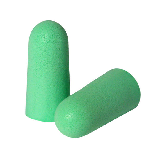 a pair of green pills on a white background